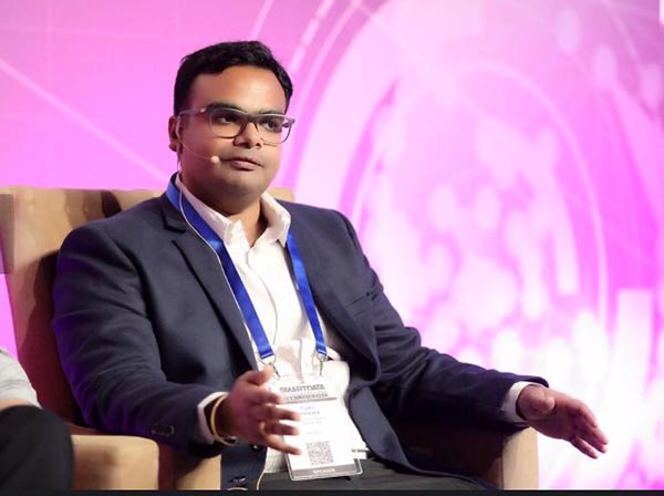 Tejasvi Addagada speaking on a panel